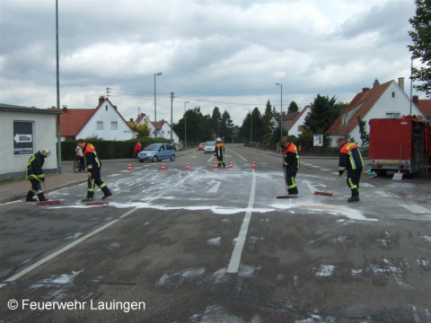 Reinigen der Fahrbahn